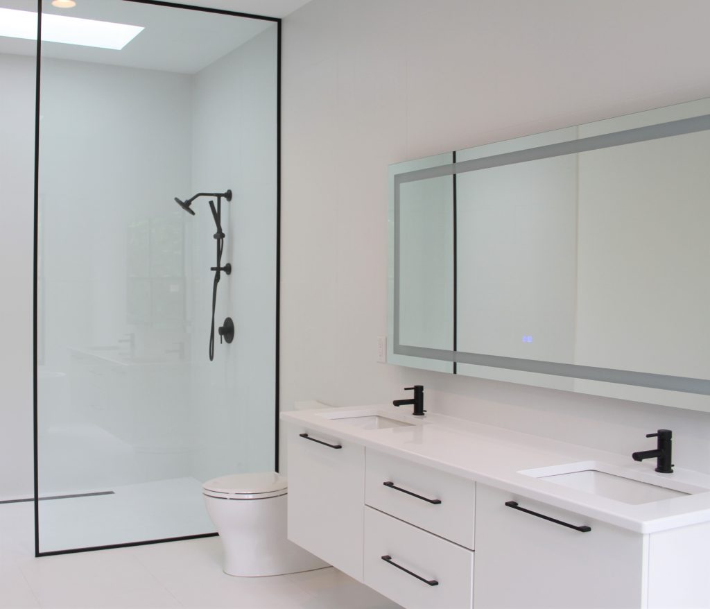 en suite bathroom with floating double vanities