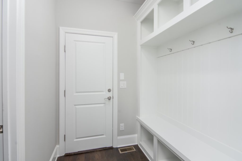 home mud room with shelving