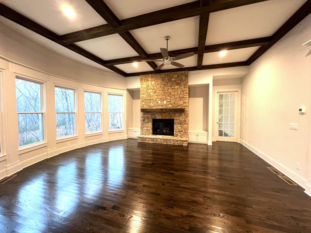 Kingsley Custom Living Room with Fireplace, Wooden Beams and large windows