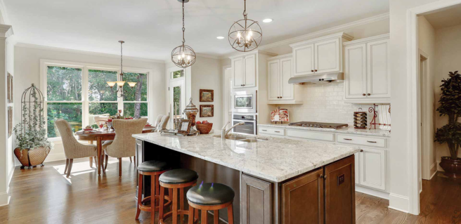 custom kitchens with large kitchen island, white cabinetry, pendant lighting